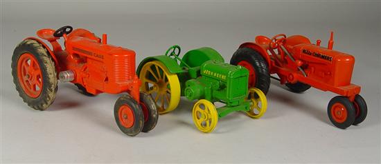 Appraisal: Three Toy Tractors Orange Plastic Case Row Crop Tractor Circa