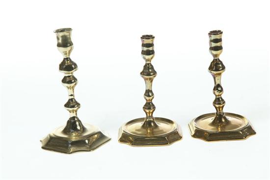 Appraisal: THREE BRASS CANDLESTICKS England th century Pair and single with