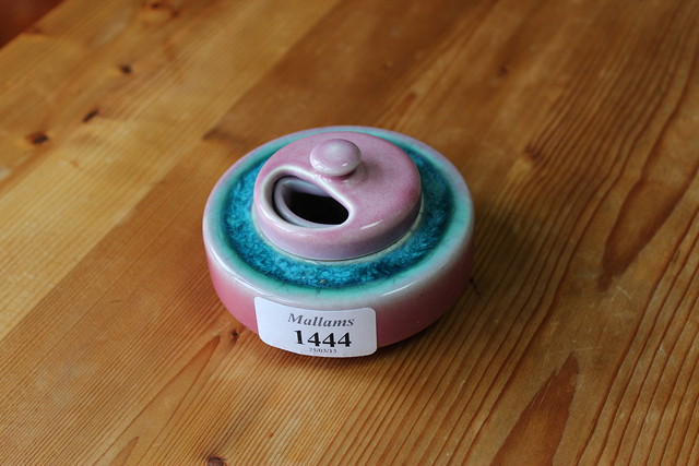 Appraisal: A RUSKIN POTTERY PINK AND BLUE GLAZED CIRCULAR INKWELL with