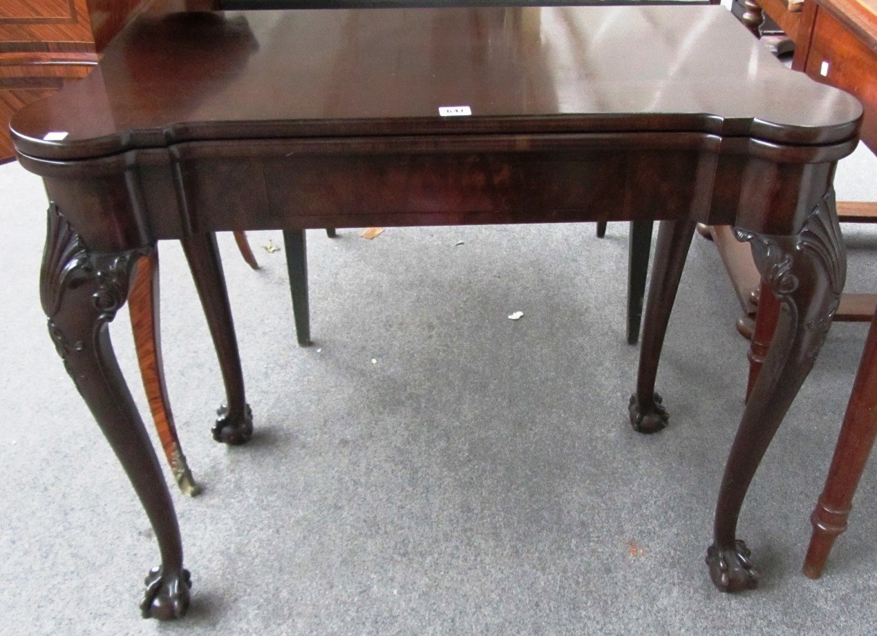 Appraisal: A mid th century style mahogany card table with out