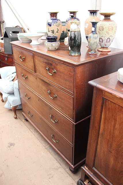 Appraisal: AN EARLY TH CENTURY COTTAGE CUT CHEST of two short