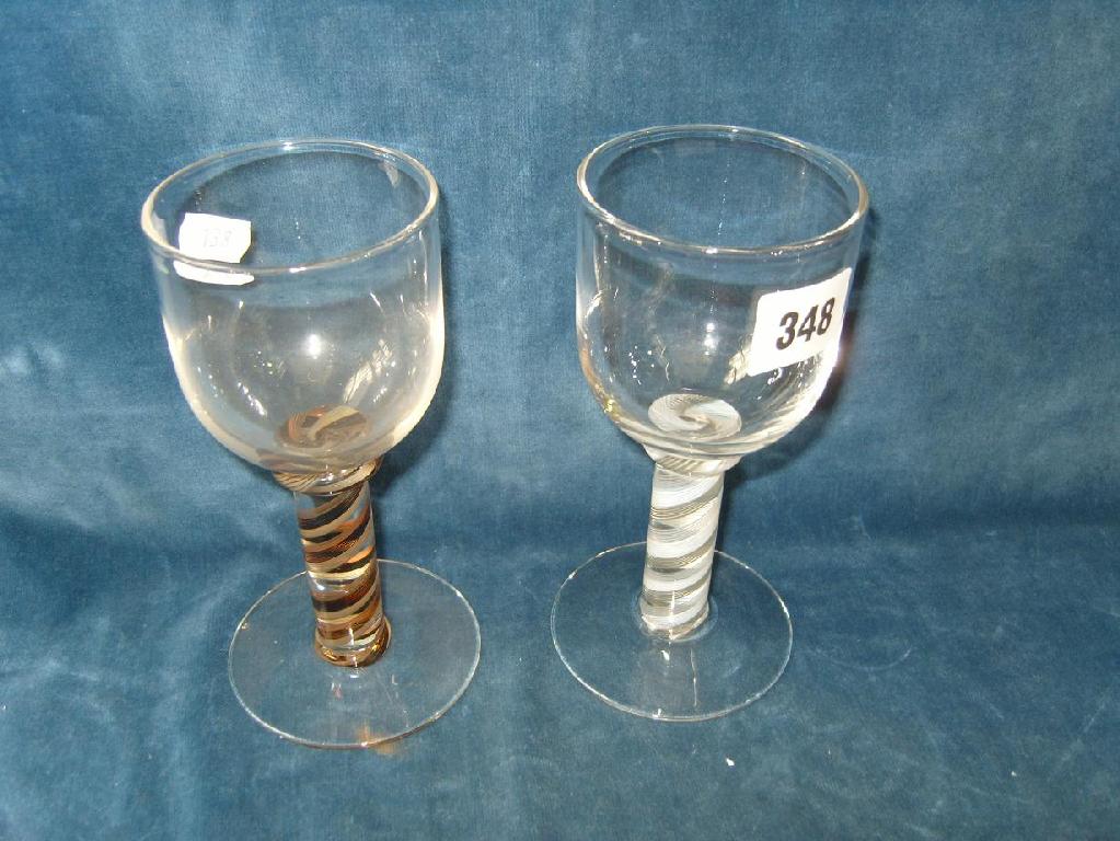 Appraisal: Two sets each of six drinking glasses with opaque spiral