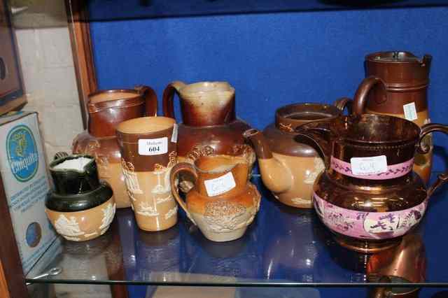 Appraisal: A QUANTITY OF DOULTON STONEWARE with sprigged decoration various jugs