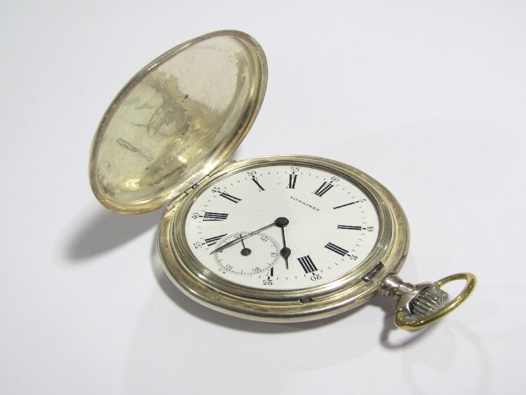 Appraisal: A Longines full hunter pocket watch with engraved silver case