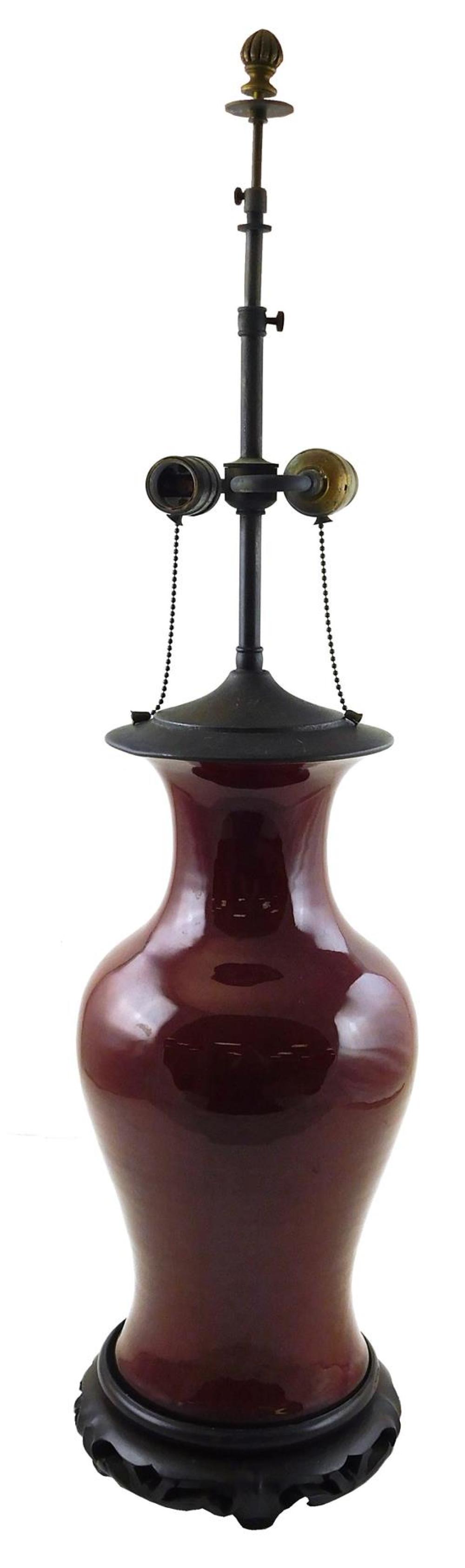 Appraisal: Oxblood glazed table lamp porcelain vasiform with carved wooden base