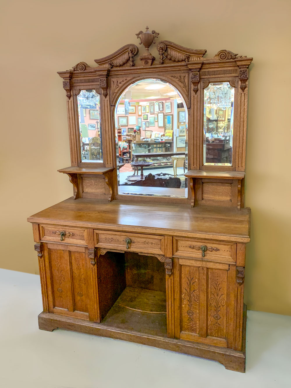 Appraisal: CARVED VICTORIAN GOLDEN OAK SIDEBOARD WITH MIRROR Victorian oak sideboard