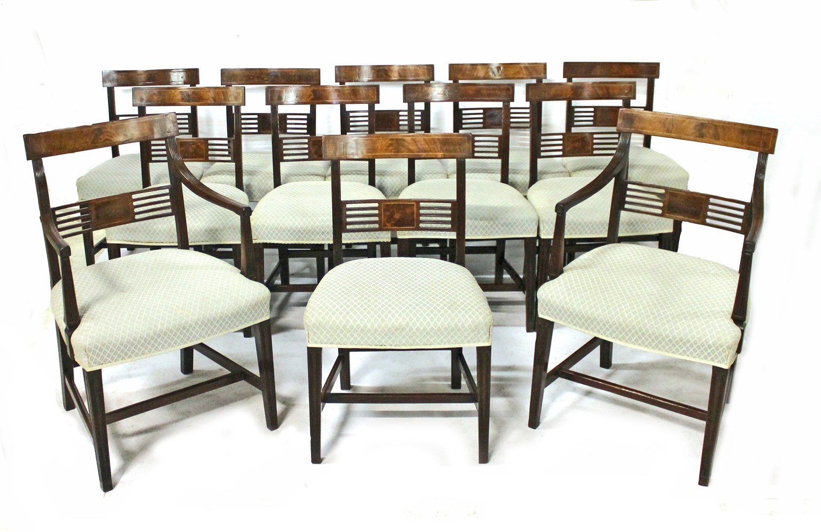 Appraisal: A set of twelve George III mahogany dining chairs with