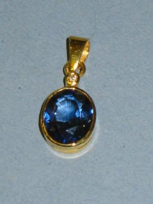 Appraisal: A SAPPHIRE PENDANT the oval cut sapphire collet set in