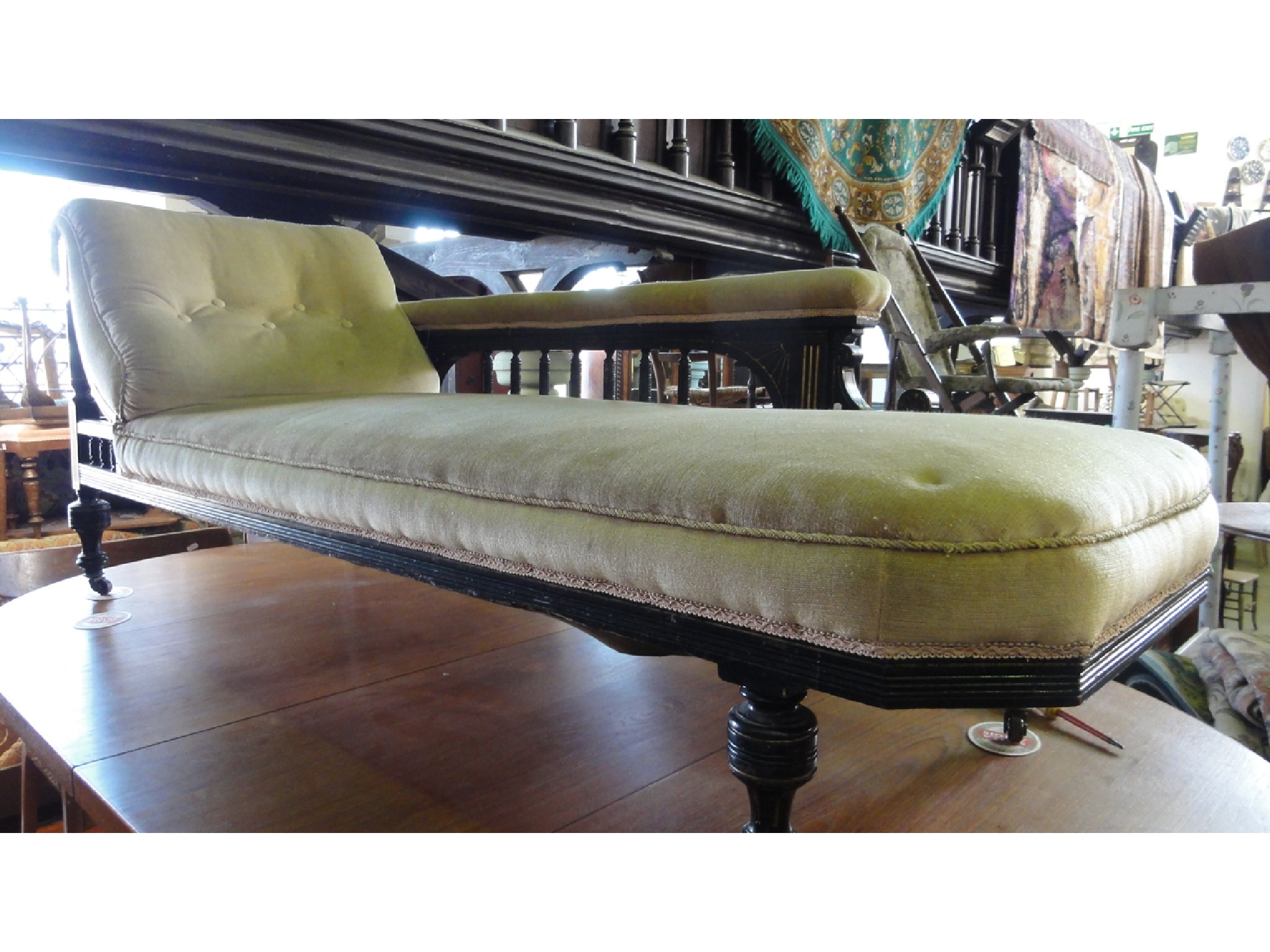 Appraisal: A late Victorian aesthetic movement period chaise lounge with upholstered