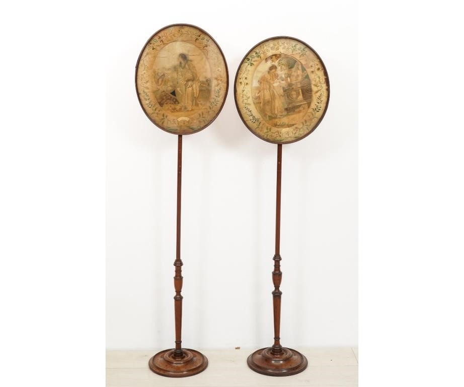 Appraisal: Two Regency silk needlework pole screens circa with mahogany stands