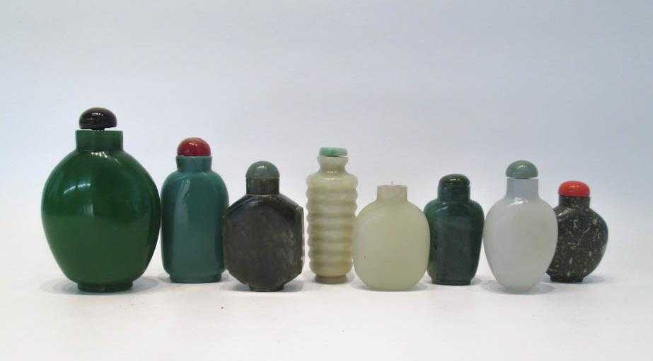 Appraisal: EIGHT CHINESE SNUFF BOTTLES made from glass serpentine and hardstone