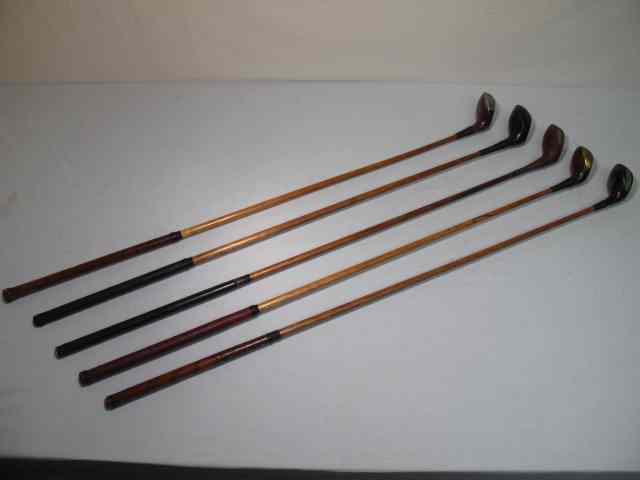 Appraisal: Fancy face wood shaft golf clubs total Includes a Great