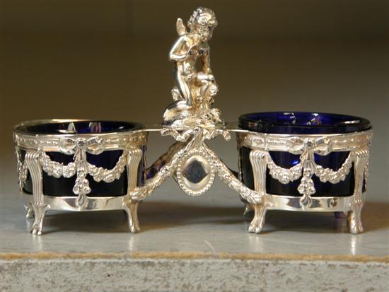 Appraisal: Continental white metal twin salt with figural decoration and two