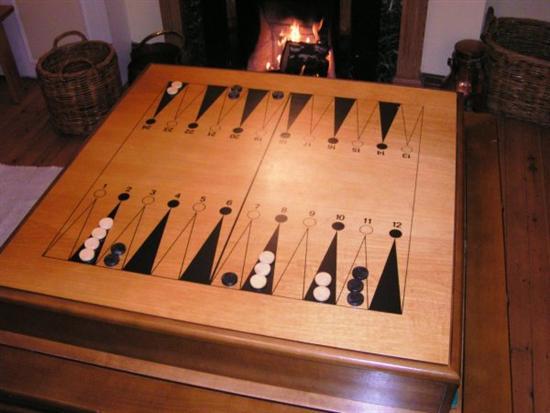 Appraisal: Simulated bamboo games table containing a collection of games