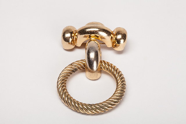 Appraisal: A Christian Dior gilt metal brooch twisted gilt metal ring