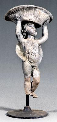 Appraisal: Cast lead garden figure winged putto holding basket over head