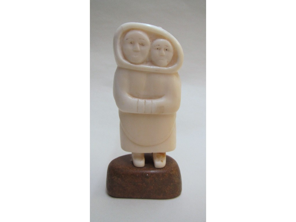 Appraisal: An Inuit marine ivory carving of a mother and child