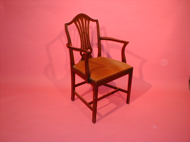 Appraisal: A set of four mahogany carver chairs in the Hepplewhite