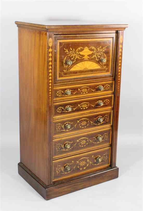 Appraisal: An Edwardian satinwood inlaid mahogany secretaire Wellington chest in the