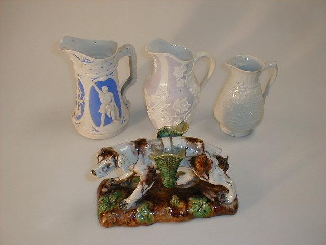 Appraisal: Three thC moulded jugs and a Staffordshire figure of a