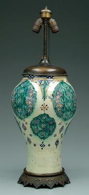 Appraisal: Moroccan vase earthenware with shaped foliate medallions now mounted as