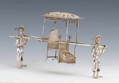 Appraisal: A Chinese Miniature Silver Palanquin with Two Figures The two