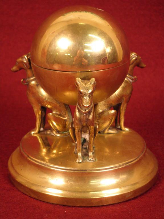 Appraisal: A Victorian brass inkwell in the form of a globe