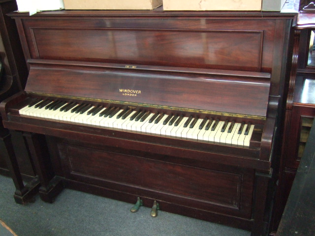 Appraisal: An iron framed mahogany cased overstrung upright piano by '