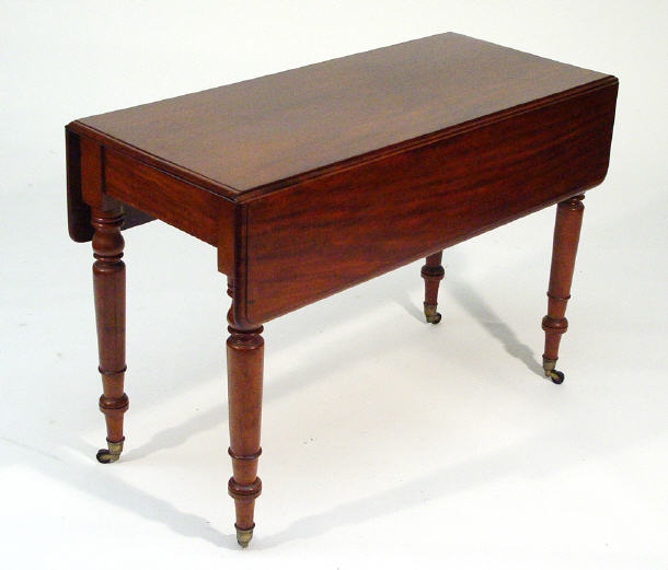 Appraisal: Victorian mahogany Pembroke table with fitted drawer to end on