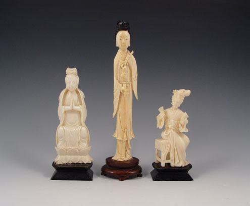 Appraisal: CHINESE CARVED IVORY FIGURES To include Woman holding fruit black