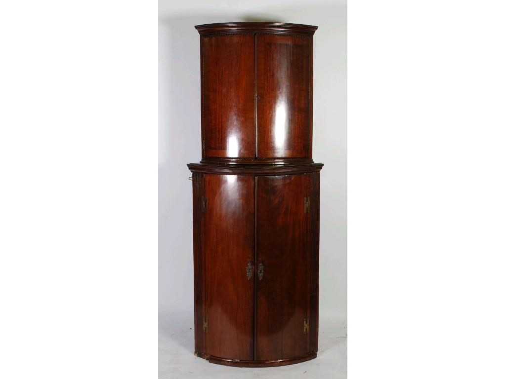 Appraisal: EARLY NINETEENTH CENTURY MAHOGANY BOW FRONTED CORNER CUPBOARD typical form