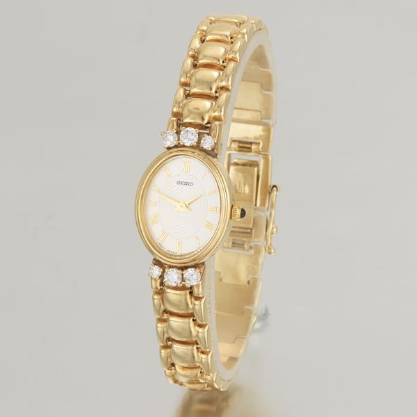 Appraisal: SEIKO K LADIES' GOLD AND DIAMOND WATCH long White matte