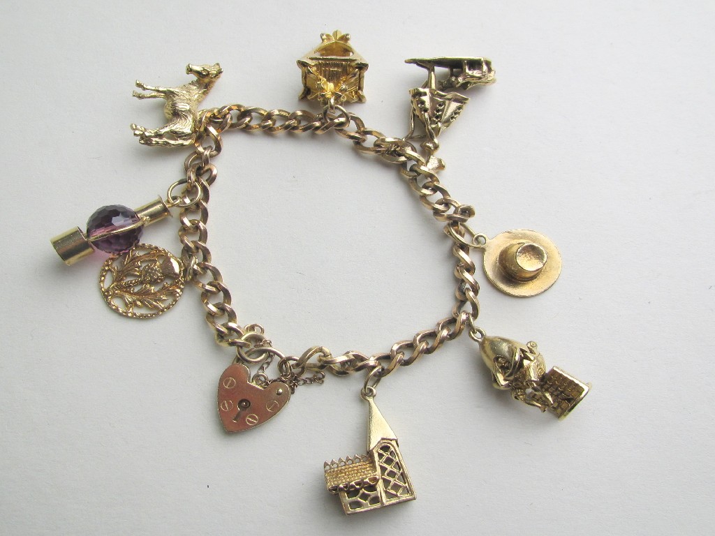 Appraisal: Nine carat gold charm bracelet with eight various ct gold