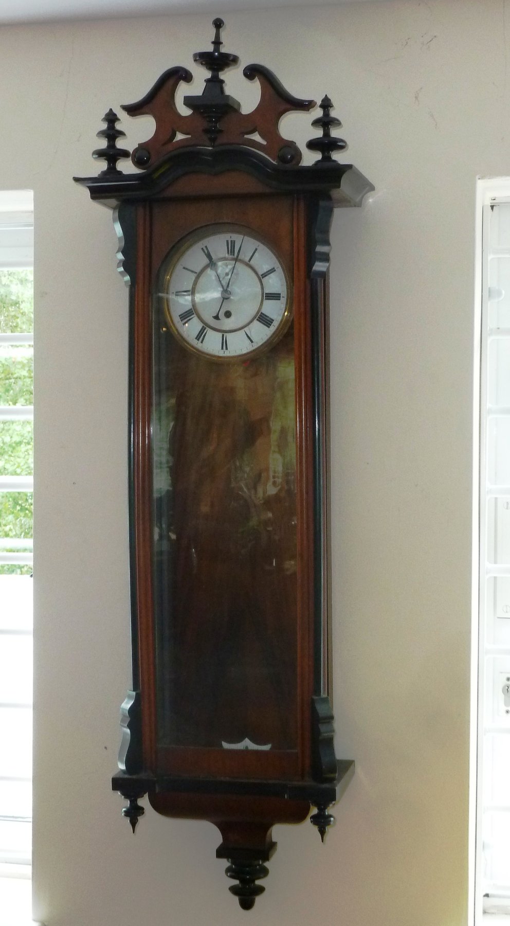 Appraisal: A th Century Vienna regulator in a walnut and ebonised