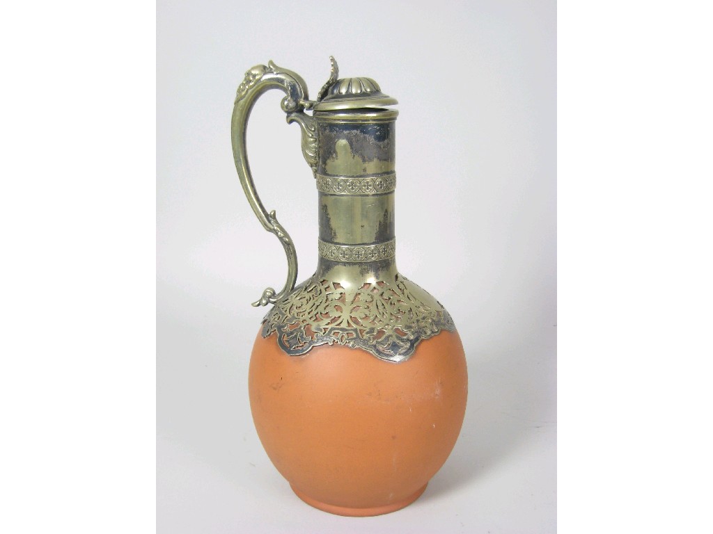 Appraisal: A th Century terracotta and silver plated Claret Jug with