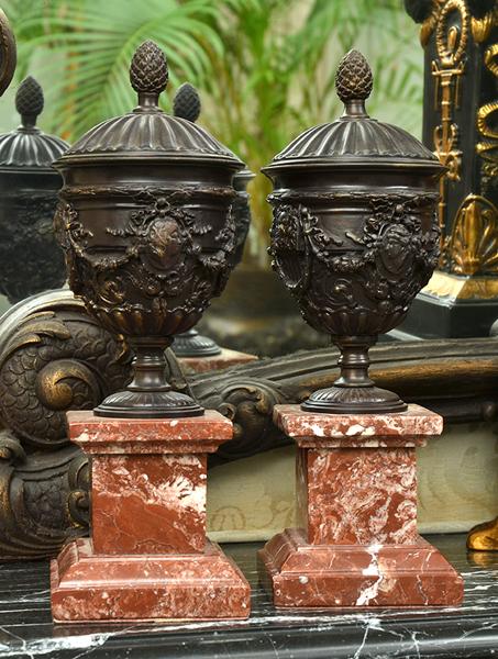 Appraisal: PAIR OF BRONZE COVERED URNS ON ROUGE MARBLE BASES