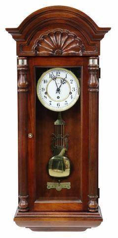 Appraisal: Howard Miller Jennison wall clock model - mahogany case carved