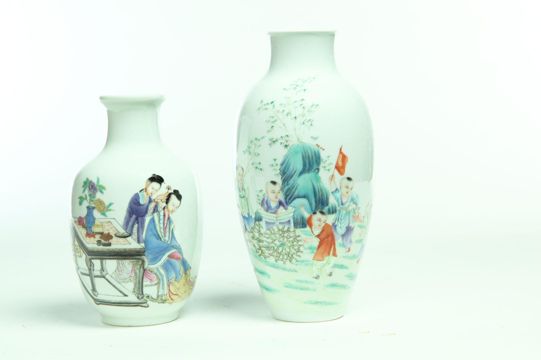 Appraisal: TWO EXPORT-STYLE VASES China th century Vivid polychrome scenes Women