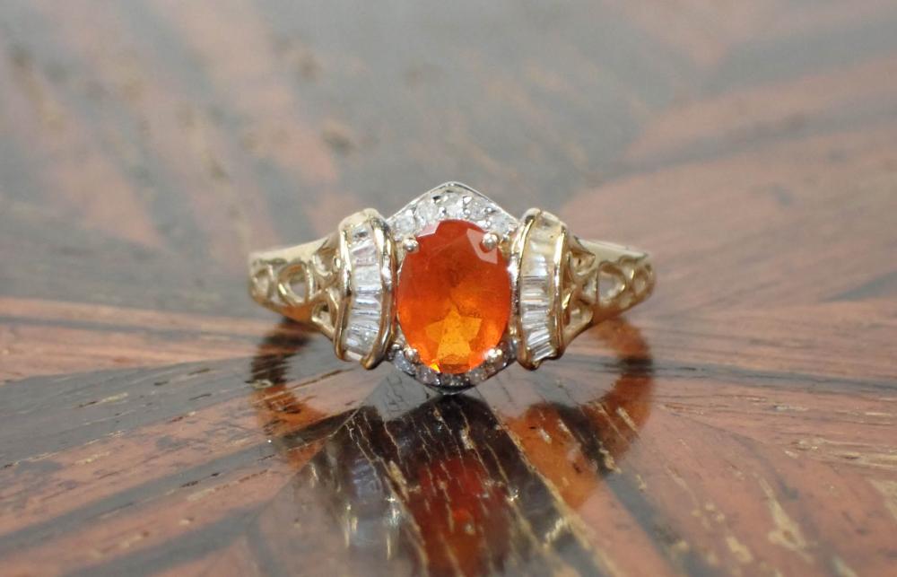 Appraisal: FIRE OPAL DIAMOND AND FOURTEEN KARAT GOLD RING The k