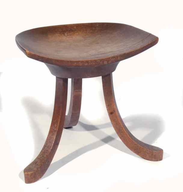 Appraisal: A LIBERTY STYLE SMALL THEBES STOOL on swept supports