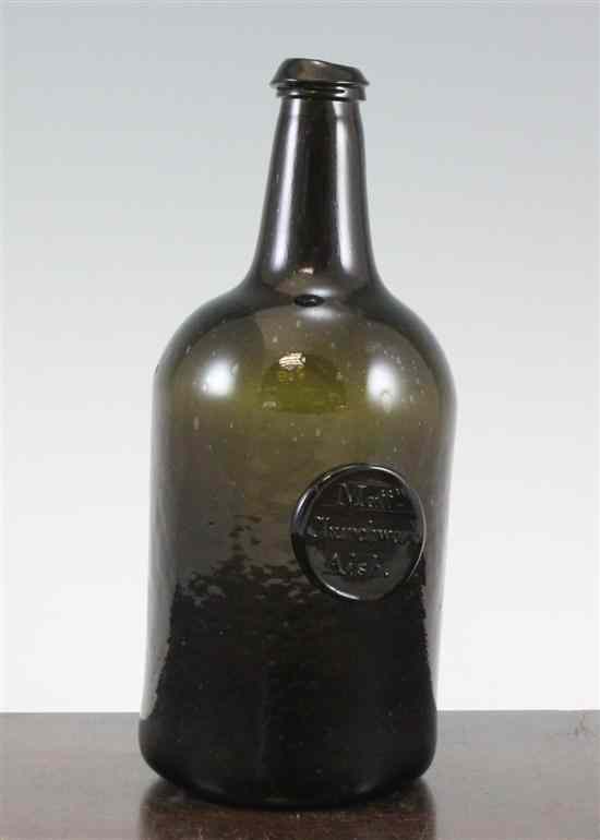 Appraisal: A black glass sealed wine bottle c of cylindrical form