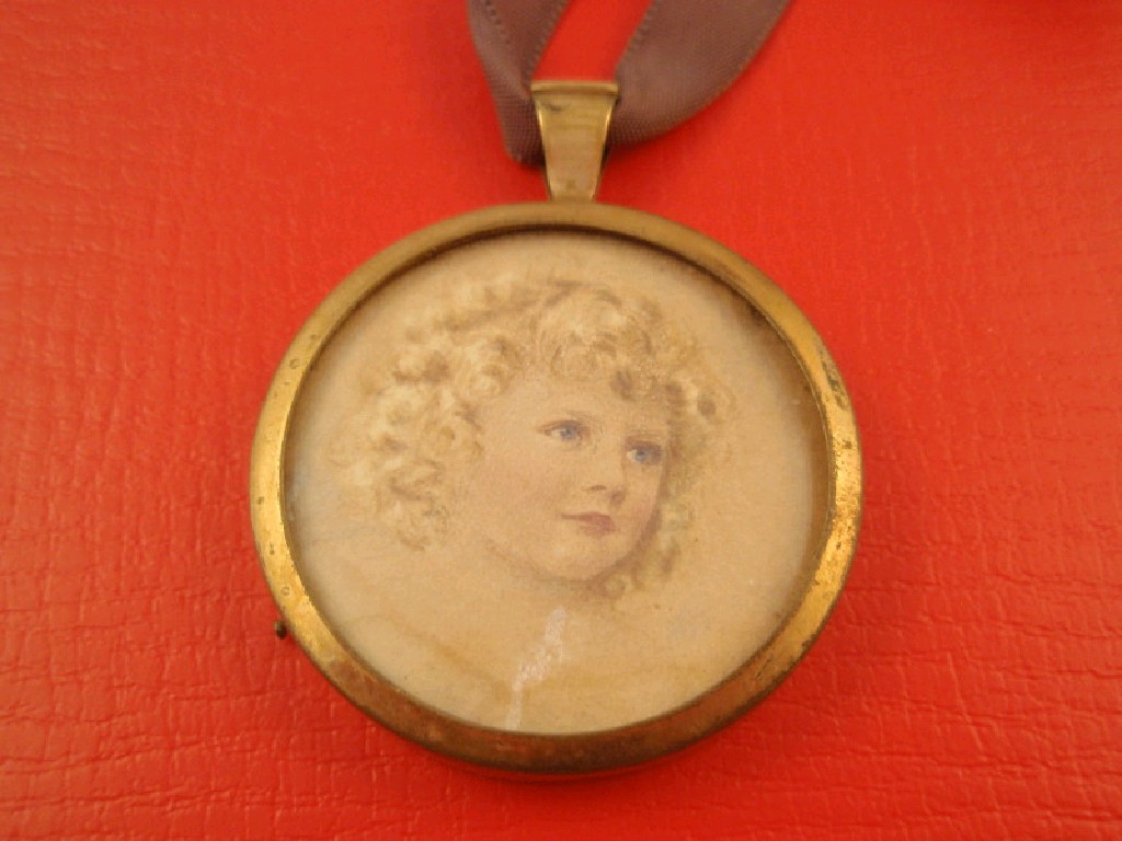 Appraisal: A yellow metal frame holding a watercolour of a young