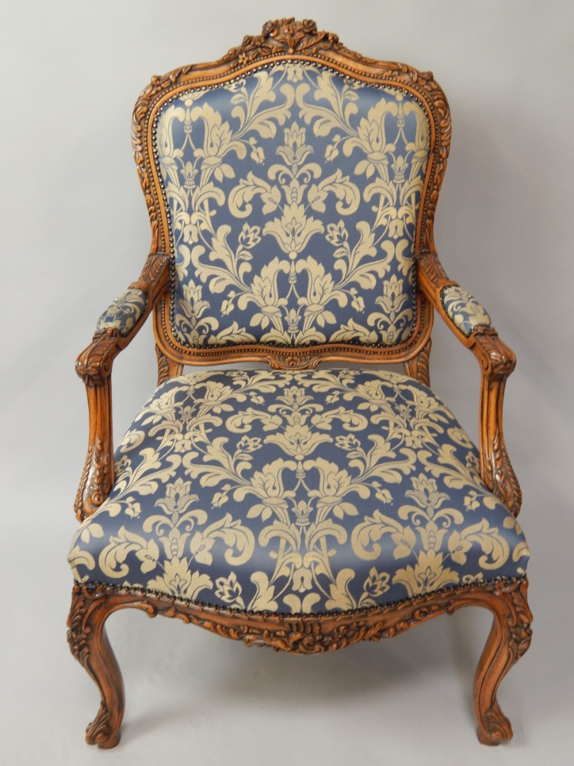 Appraisal: A Louis XV style stained beech fauteuil with blue floral