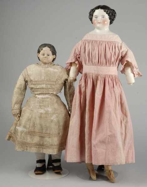 Appraisal: Lot of Early Dolls Description Papier-m ch shoulder head with