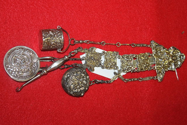 Appraisal: A SILVER CHATELAINE fitted with a number of attachments with