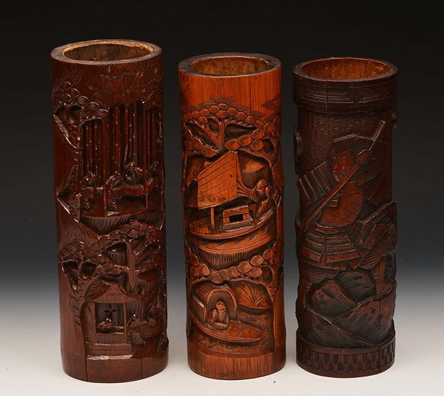 Appraisal: THREE CHINESE AND JAPANESE BAMBOO CYLINDRICAL VASES each with carved