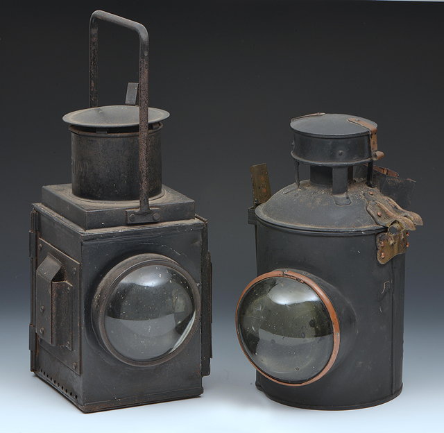 Appraisal: A BLACK PAINTED SQUARE RAILWAY LANTERN with two bull's-eye lenses