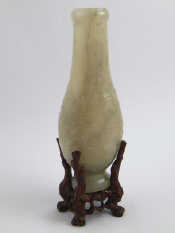 Appraisal: A Chinese carved pear shaped jade vase with archaistic floral