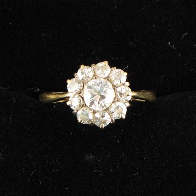 Appraisal: A diamond cluster ring the ten diamonds are set in