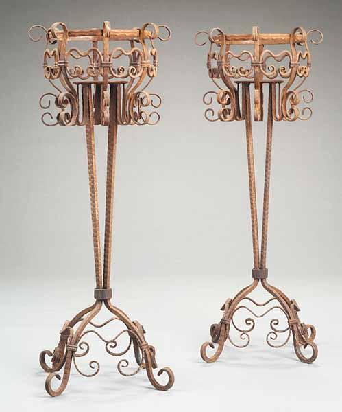 Appraisal: A Pair of Scrollwork Wrought Iron Stands tapering supports conforming